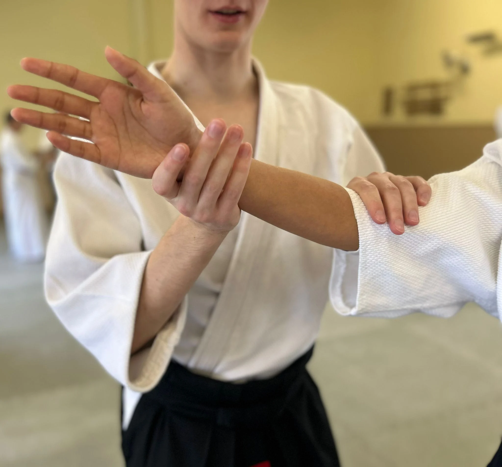 Students practising tanto techniques at a weekend course